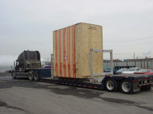 Picture of Large crate on double drop low boy trailer