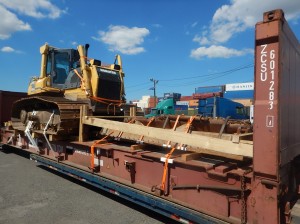 over dimensional machinery on flat rack