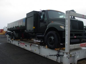 Picture of a tanker truck loaded on a flat rack