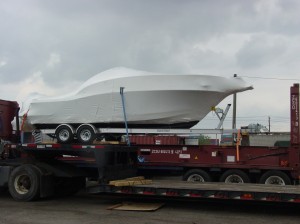 Picture of a boat loaded on a flat rack