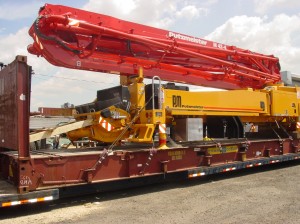Concrete pump loaded on a flat rack